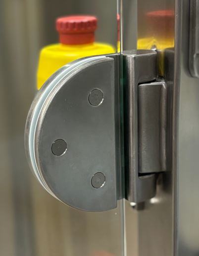 An industrial hinge in a D shape with 3 small screw with hidden hole.