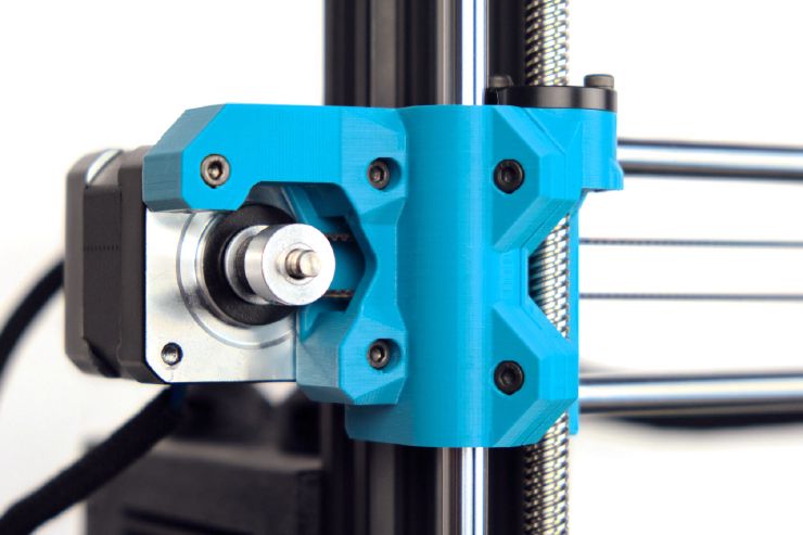 A close view of the motor mount of the X axis with parts printed in blue PETG